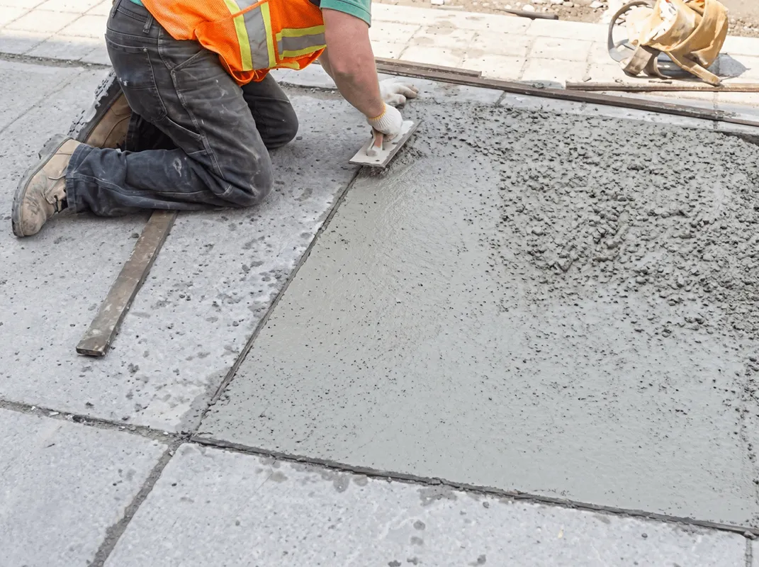 Professional repairing a concrete floor in Fresno, CA