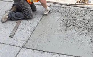 Professional repairing a concrete floor in Fresno, CA