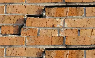 Brick wall with serious structural damage in Fresno, CA